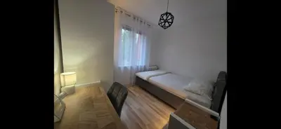 Łóżko lub łóżka w pokoju w obiekcie Pogodne Mieszkanko