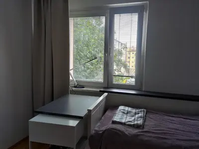 Łóżko lub łóżka w pokoju w obiekcie Budziszynska