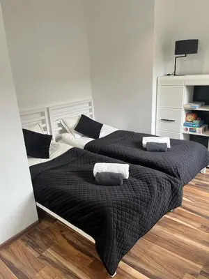 Łóżko lub łóżka w pokoju w obiekcie Apartament Perła w Kłodzku