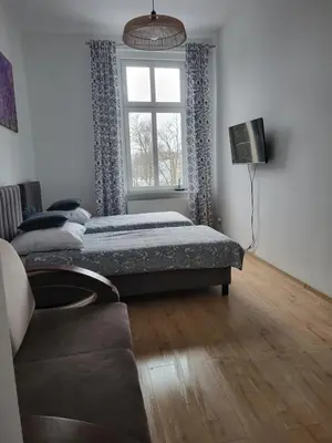 Łóżko lub łóżka w pokoju w obiekcie AS ELITE Studio Kozielska 12 parking Blisko Onkologii