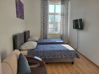 Łóżko lub łóżka w pokoju w obiekcie AS ELITE Studio Kozielska 12 parking Blisko Onkologii