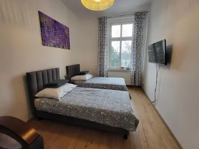 Łóżko lub łóżka w pokoju w obiekcie AS ELITE Studio Kozielska 12 parking Blisko Onkologii