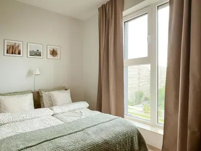 Łóżko lub łóżka w pokoju w obiekcie Legnicka Residence 38