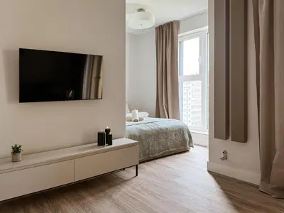 Łóżko lub łóżka w pokoju w obiekcie Legnicka Residence 38