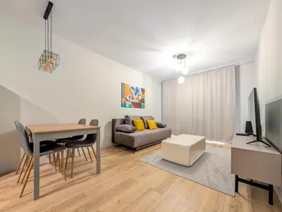 Telewizja i/lub zestaw kina domowego w obiekcie Mieszczańska Cozy Apartment by BookingHost