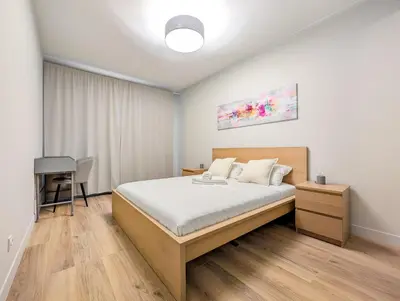 Łóżko lub łóżka w pokoju w obiekcie Mieszczańska Cozy Apartment by BookingHost