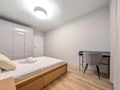 Łóżko lub łóżka w pokoju w obiekcie Mieszczańska Cozy Apartment by BookingHost