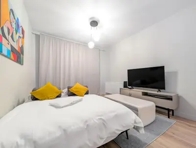 Telewizja i/lub zestaw kina domowego w obiekcie Mieszczańska Cozy Apartment by BookingHost