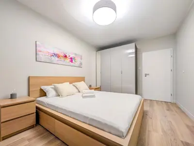 Łóżko lub łóżka w pokoju w obiekcie Mieszczańska Cozy Apartment by BookingHost