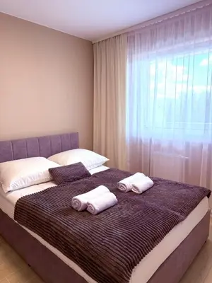 Łóżko lub łóżka w pokoju w obiekcie LOFT APARTAMENT II Kępno