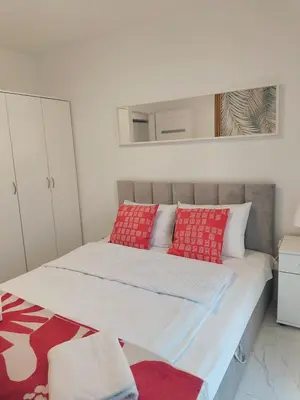 Łóżko lub łóżka w pokoju w obiekcie Aura Apartamenty