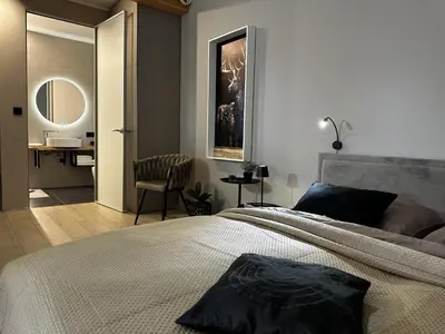 Łóżko lub łóżka w pokoju w obiekcie Loft N 39 - ekskluzywny apartament pod Zamkiem w Mosznej