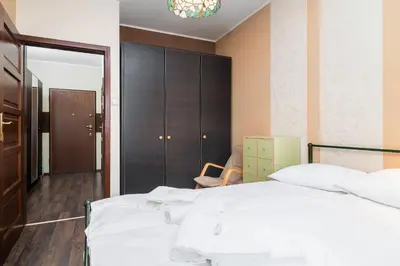 Łóżko lub łóżka w pokoju w obiekcie Inowrocławska 17 Apartamenty Platinum by Noclegi Renters