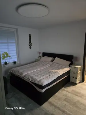 Łóżko lub łóżka w pokoju w obiekcie Apartamenty U Władzia