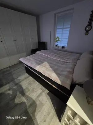 Łóżko lub łóżka w pokoju w obiekcie Apartamenty U Władzia