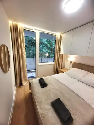 Łóżko lub łóżka w pokoju w obiekcie apartament z sauną CIS