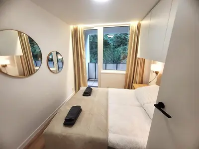 Łóżko lub łóżka w pokoju w obiekcie apartament z sauną CIS