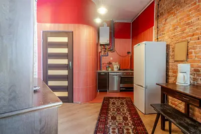 Kuchnia lub aneks kuchenny w obiekcie Gliwice Industrial Brick Style Apartment by BookingHost