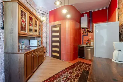 Kuchnia lub aneks kuchenny w obiekcie Gliwice Industrial Brick Style Apartment by BookingHost