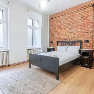 Gliwice Industrial Brick Style Apartment by BookingHost