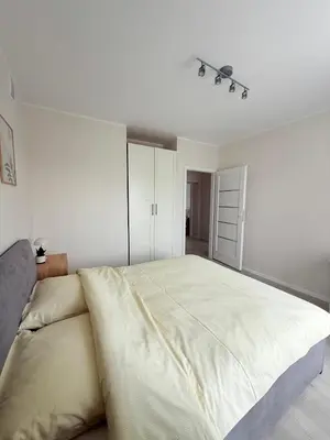 Łóżko lub łóżka w pokoju w obiekcie Apartament dla 4 osób