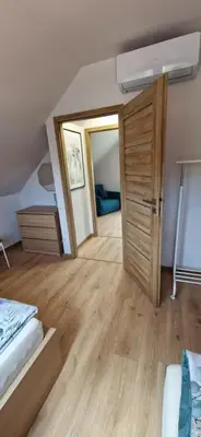Łóżko lub łóżka w pokoju w obiekcie Prosta Turawa