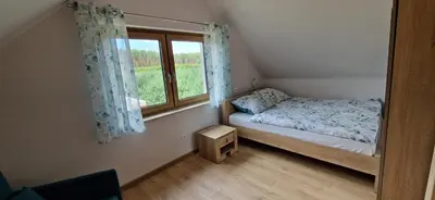 Łóżko lub łóżka w pokoju w obiekcie Prosta Turawa