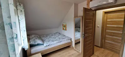 Łóżko lub łóżka w pokoju w obiekcie Prosta Turawa