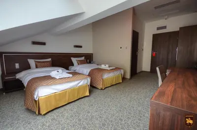Łóżko lub łóżka w pokoju w obiekcie CTKiR Browar Probus
