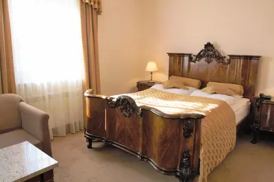 Łóżko lub łóżka w pokoju w obiekcie Hotel Sulisław