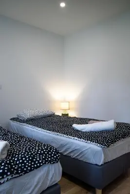 Łóżko lub łóżka w pokoju w obiekcie Lipowa Apartamenty