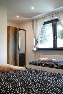 Łóżko lub łóżka w pokoju w obiekcie Lipowa Apartamenty