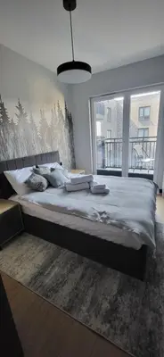 Łóżko lub łóżka w pokoju w obiekcie AMapartments Sienkiewicza Residence - Ekskluzywny apartament w sercu Wrocławia z dostępem do tarasu na dachu