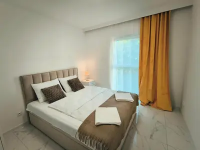 Łóżko lub łóżka w pokoju w obiekcie Aura Apartamenty 2