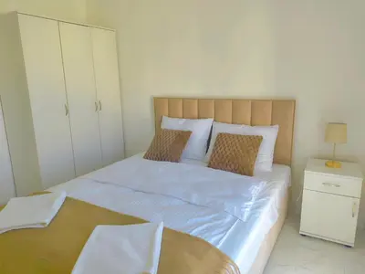 Łóżko lub łóżka w pokoju w obiekcie Aura Apartamenty 2