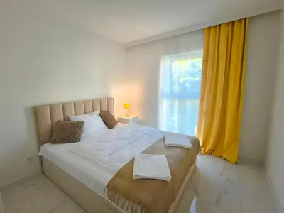 Łóżko lub łóżka w pokoju w obiekcie Aura Apartamenty 2