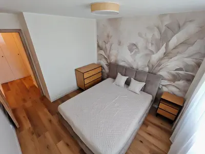 Łóżko lub łóżka w pokoju w obiekcie Panorama apartament