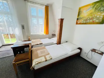 Łóżko lub łóżka w pokoju w obiekcie Ośrodek Wypoczynkowy Agat