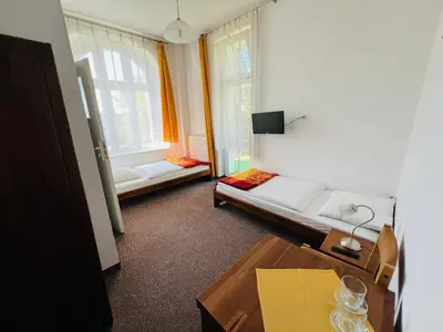 Łóżko lub łóżka w pokoju w obiekcie Ośrodek Wypoczynkowy Agat