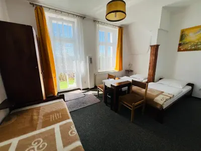 Łóżko lub łóżka w pokoju w obiekcie Ośrodek Wypoczynkowy Agat
