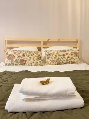 Łóżko lub łóżka w pokoju w obiekcie Apartamenty Zloty Pociąg