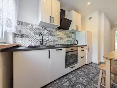 Kuchnia lub aneks kuchenny w obiekcie Hiszpańska Harmony Apartment by BookingHost