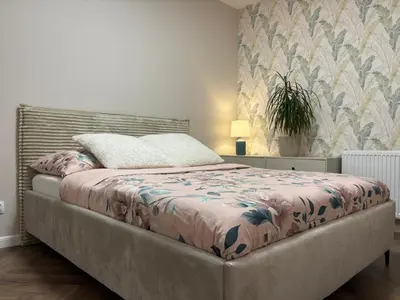 Łóżko lub łóżka w pokoju w obiekcie Komfortowe Planty Racławickie