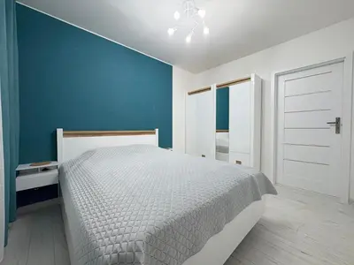 Łóżko lub łóżka w pokoju w obiekcie Apartament nad Zalewem