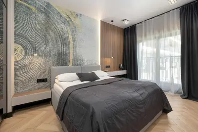 Łóżko lub łóżka w pokoju w obiekcie Modern Apartment with AC & Parking in Wrocław by Noclegi Renters
