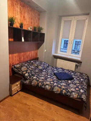 Łóżko lub łóżka w pokoju w obiekcie WrocLove AP
