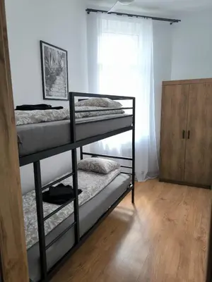 Łóżko lub łóżka w pokoju w obiekcie Apartament Centrum 2