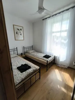 Łóżko lub łóżka w pokoju w obiekcie Apartament Centrum 2