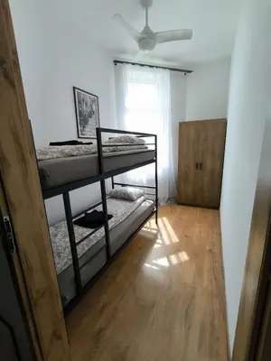 Łóżko lub łóżka w pokoju w obiekcie Apartament Centrum 2
