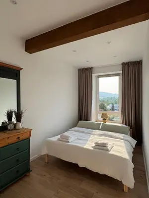 Łóżko lub łóżka w pokoju w obiekcie Apartament Między Szlakami